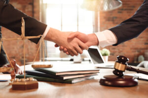 Handshake between a businessman and his lawyer.